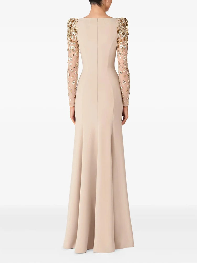 Gwendolyn Diamond Dress in beige, back view of floor-length mermaid silhouette with beaded sheer sleeves