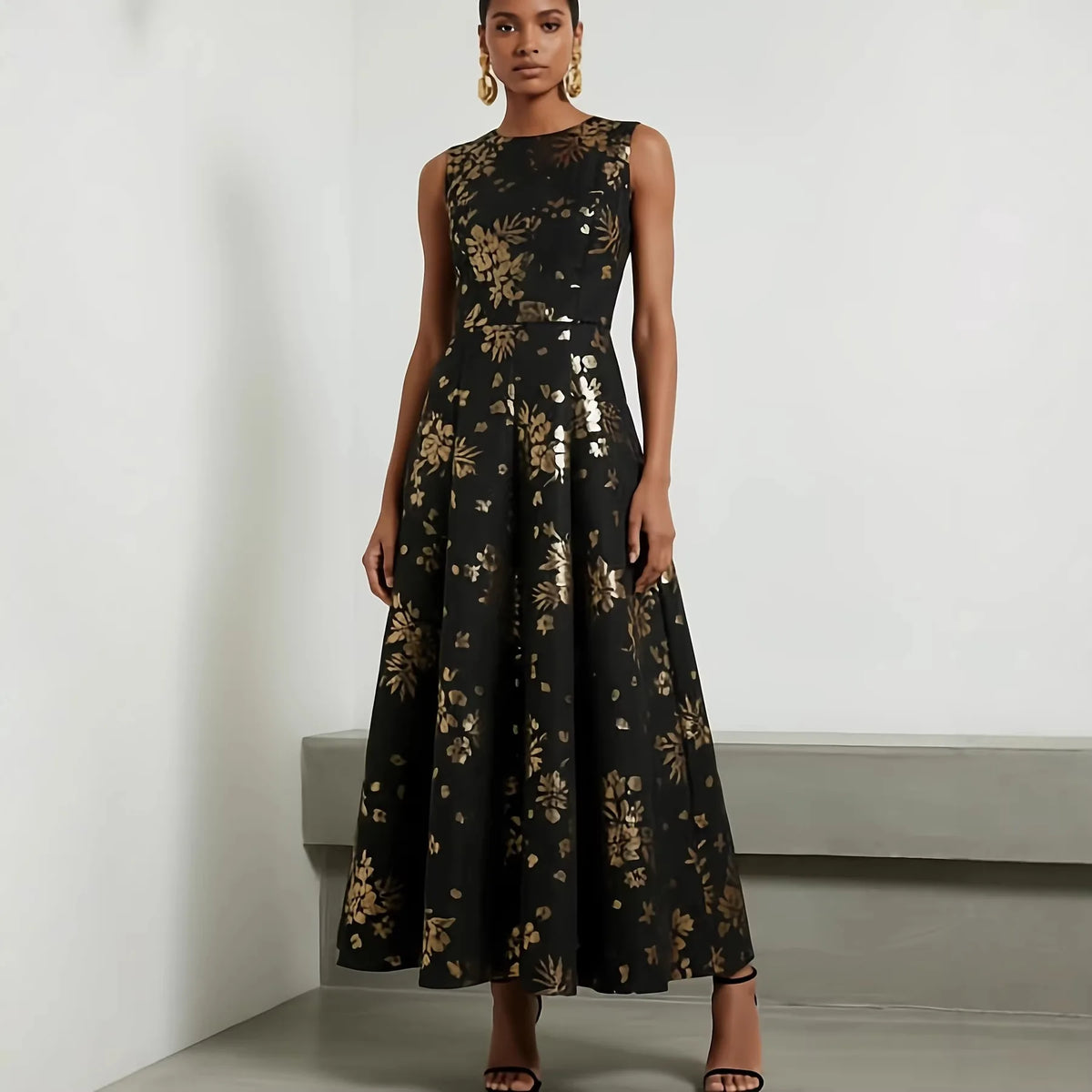 Amunet black dress with gold floral print, round neck and fitted bodice with seamed waist