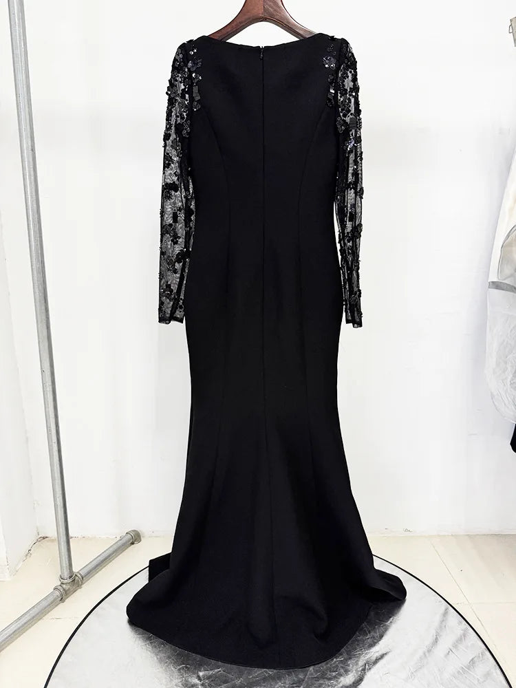 Gwendolyn Diamond Dress in black, back view of mermaid maxi with back zip and structured shoulders
