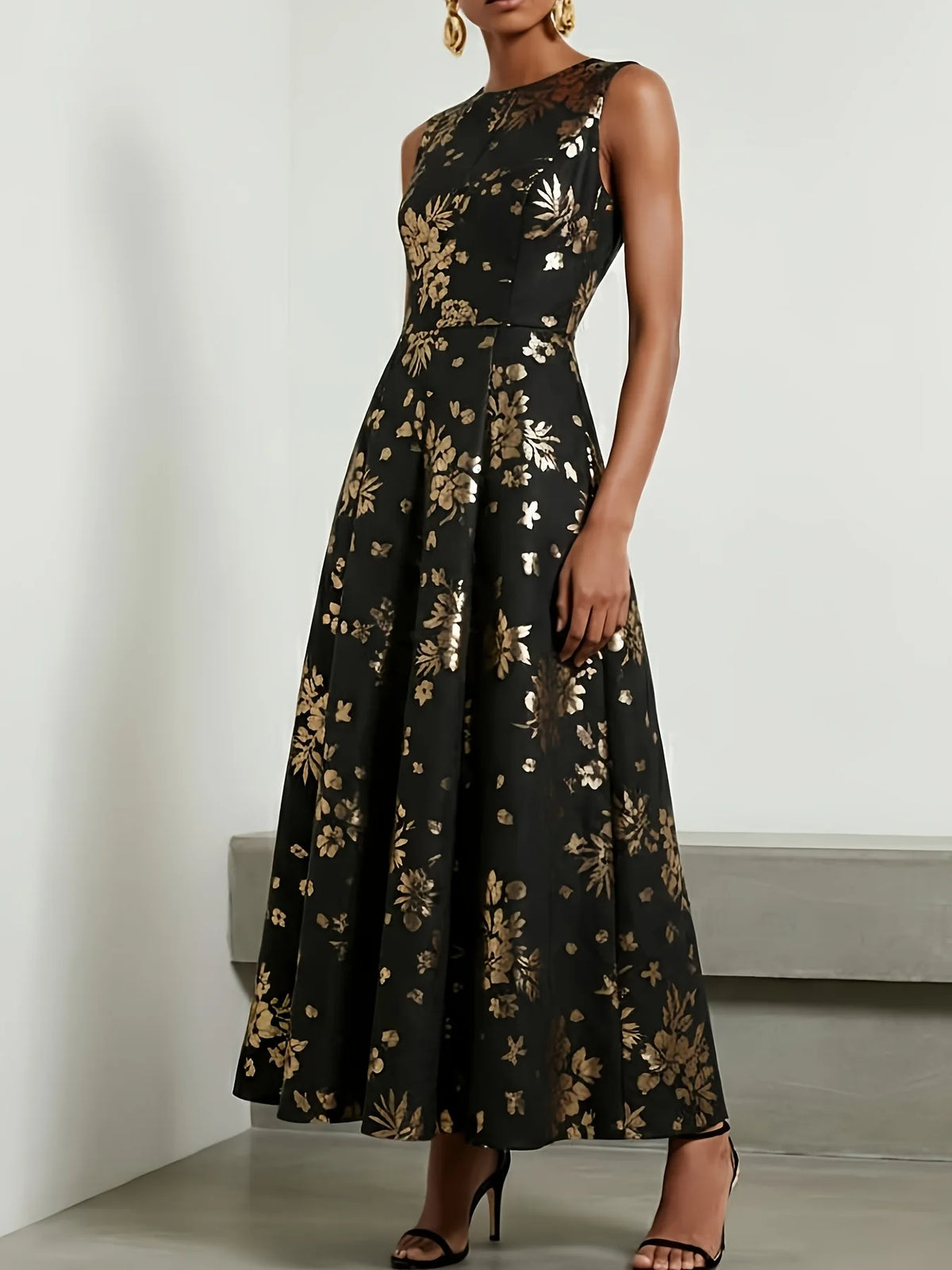 Amunet floral evening dress in black and gold with fitted bodice and ankle-length A-line skirt